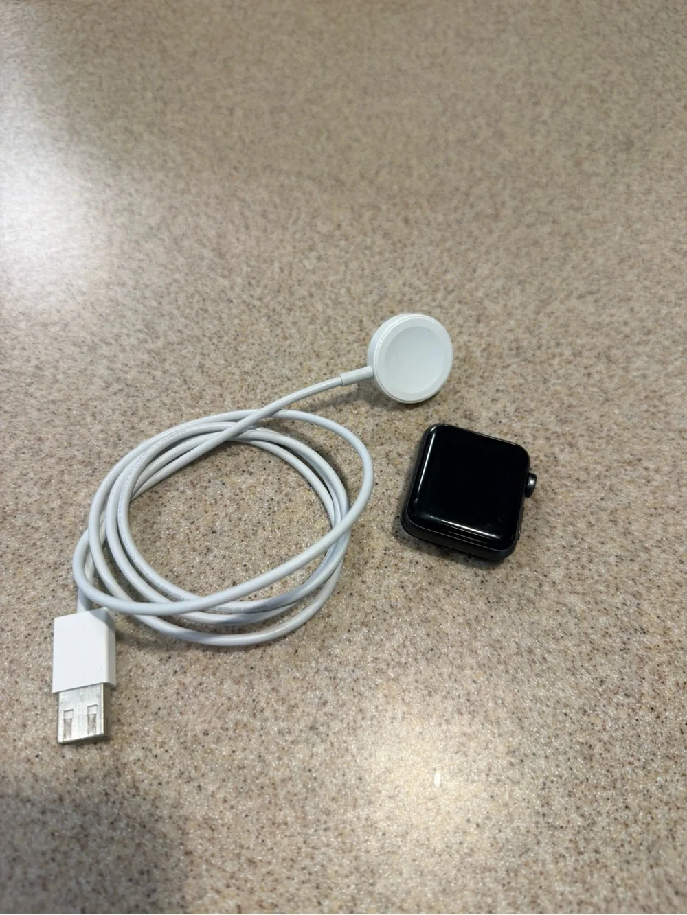 Apple Black Smartwatch with White Magnetic Charger